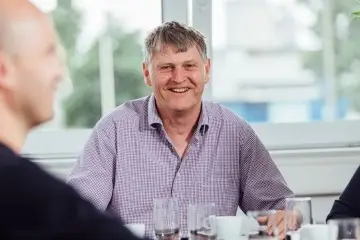 Eine männliche Person, die in die Kamera lächelt, Frank Husfeld