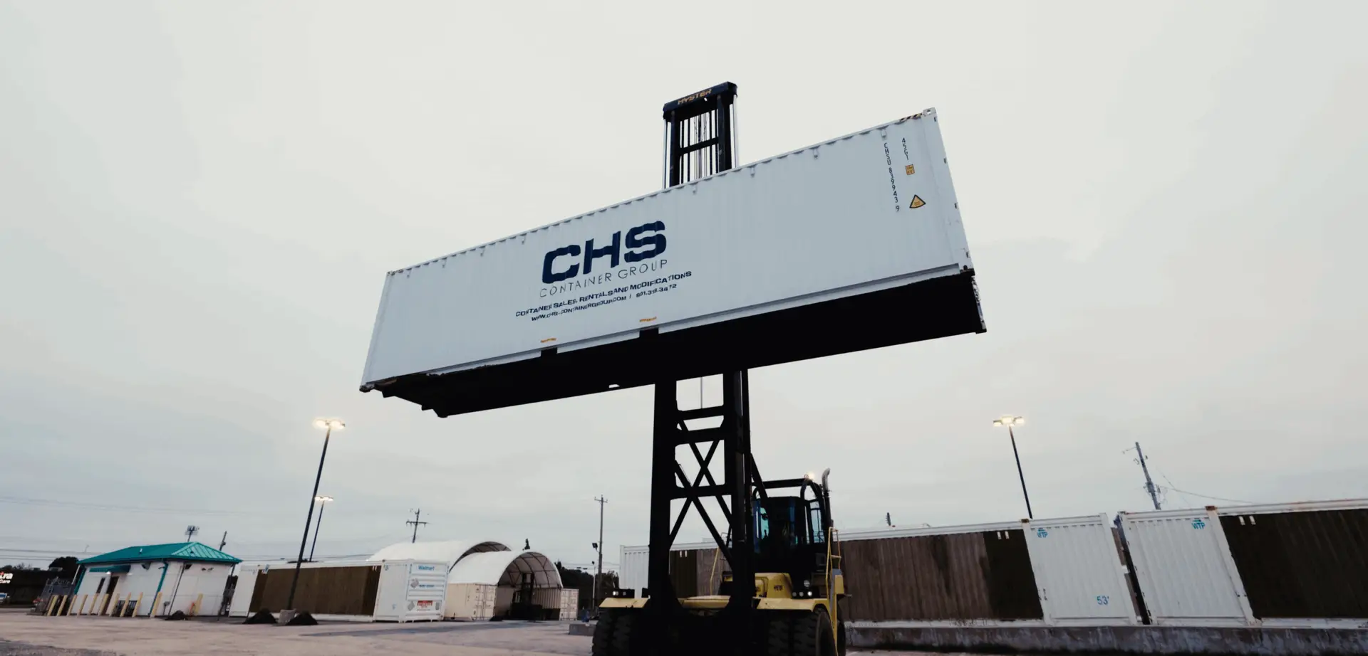 https://chs-containergroup.com/us/wp-content/uploads/sites/3/2025/12/CHS-Container-Side-Loader-scaled.webp
